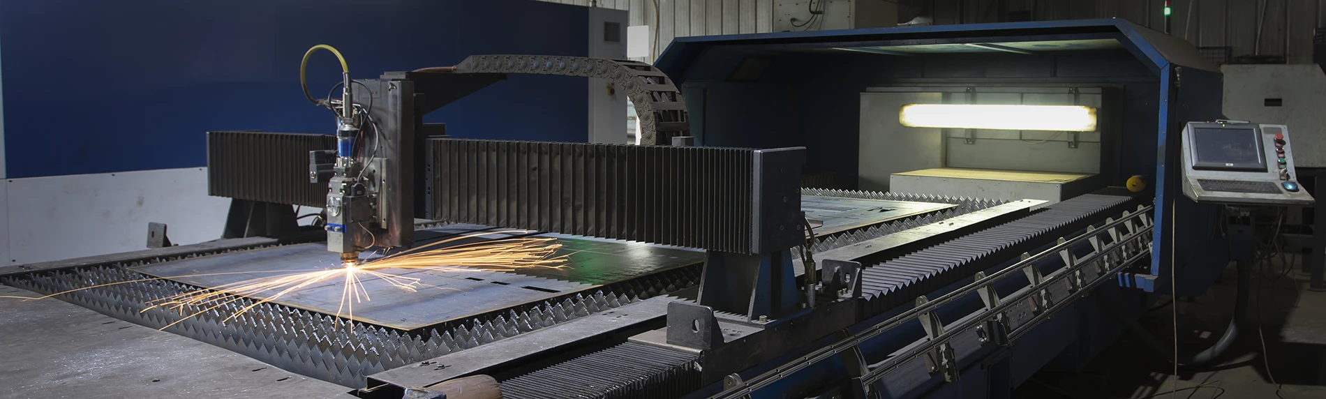 Picture of laser cutter in the process of cutting metal - Manufacturing Insurance from Agri-City Insurance